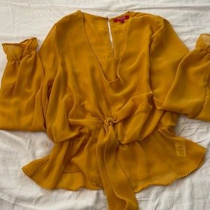 Yellow chiffon with a tie in the front.